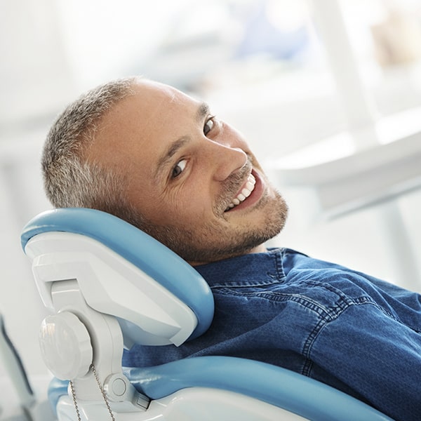Man laying in a dentist's chair