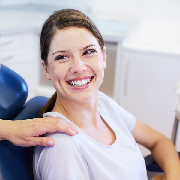 Woman sitting in a dentist's chair